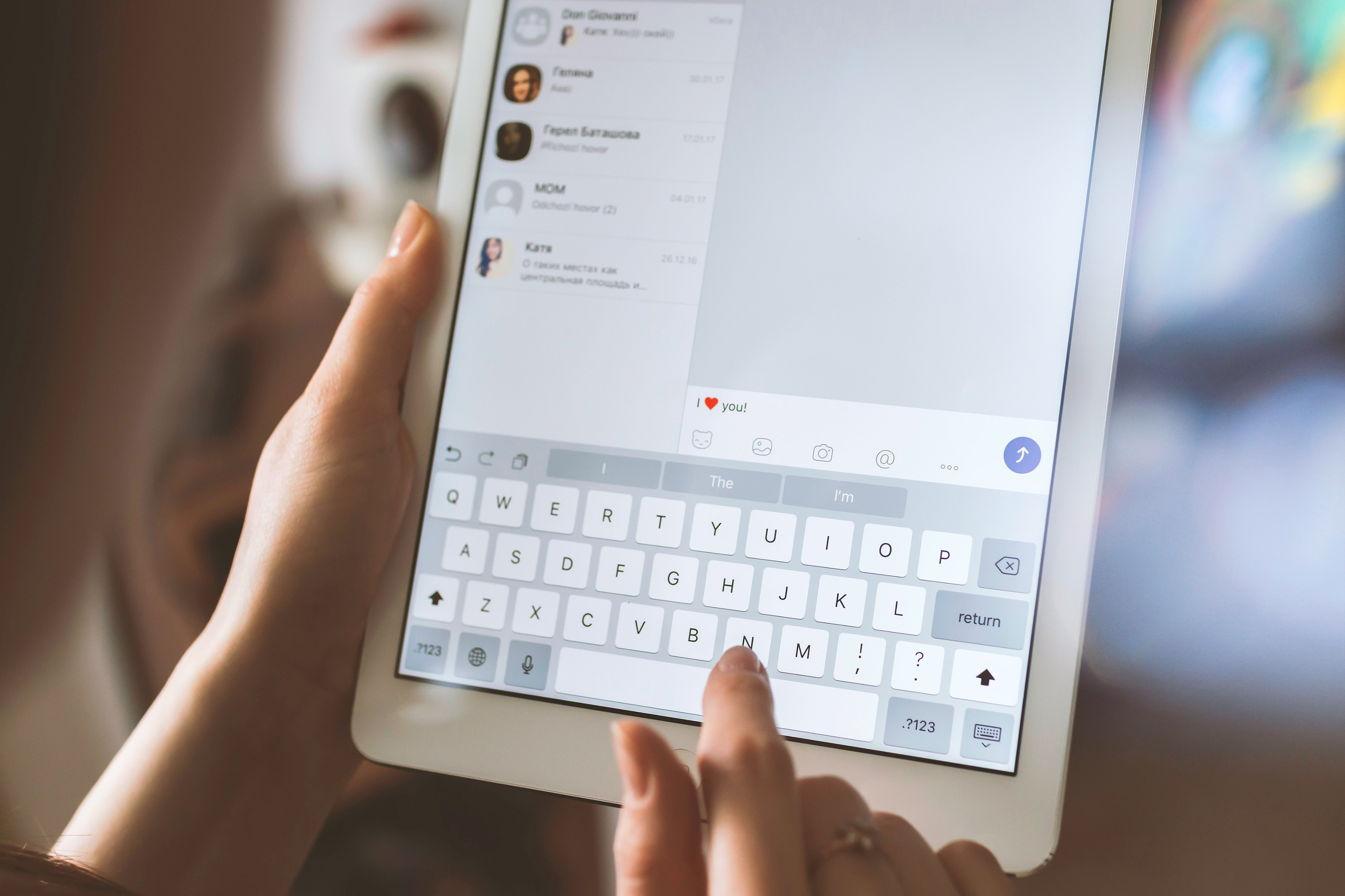 Business owner managing customer messages and reviews on tablet